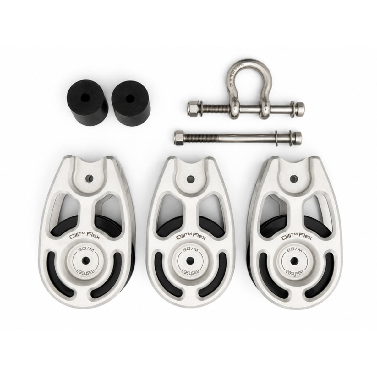 All the parts of the Olli Flex 50 M triple configuration laid out: three cheeks, two sheave spacers, the stainless shackle and the through bolts